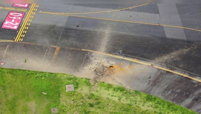 Suspected US bomb from World War II explodes at airport in Japan, causes massive crater on taxiway - CNBC TV18