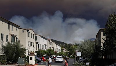 Sleepless nights, flames and heat for O.C. residents threatened by Airport Fire