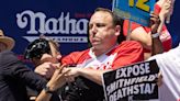 Competitive eater Joey Chestnut put a protestor in a chokehold during a hot dog eating contest and still won