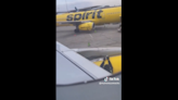 Spirit worker seen taping plane wing before flight. Don’t worry, it wasn’t duct tape