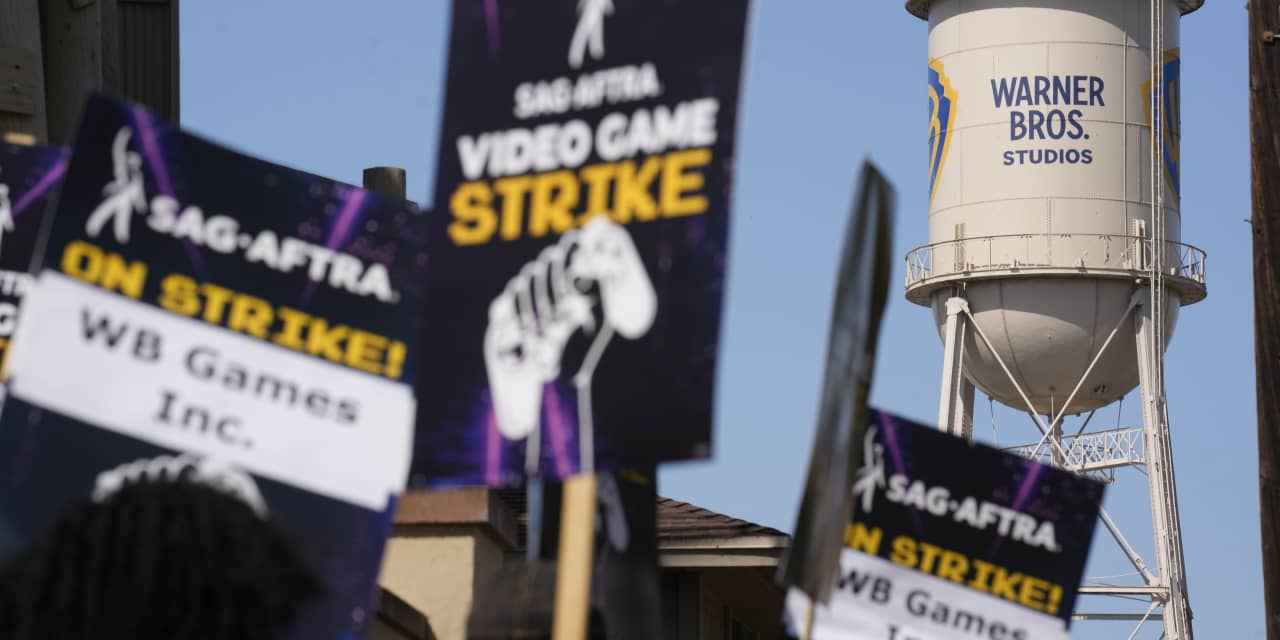 Videogame performers picket at Warner Bros. Studios over unregulated AI use
