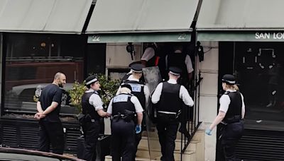 Police move in to evict squatters from Diana's favourite restaurant