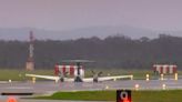 A plane with 3 aboard lands without landing gear at an Australian airport after burning off fuel