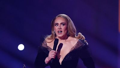 Adele pauses first Munich concert to take off part of her dress after heavy rain