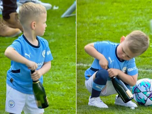 Adorable moment Phil Foden’s son, 5, tries to open bottle of champagne