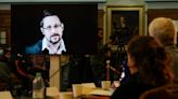 Snowden swears allegiance to Russia, receives passport: lawyer