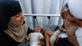 Young Gaza boy wounded and loses mother in Israeli airstrike