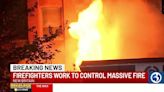 Crews battle massive fire at car repair shop in New Britain