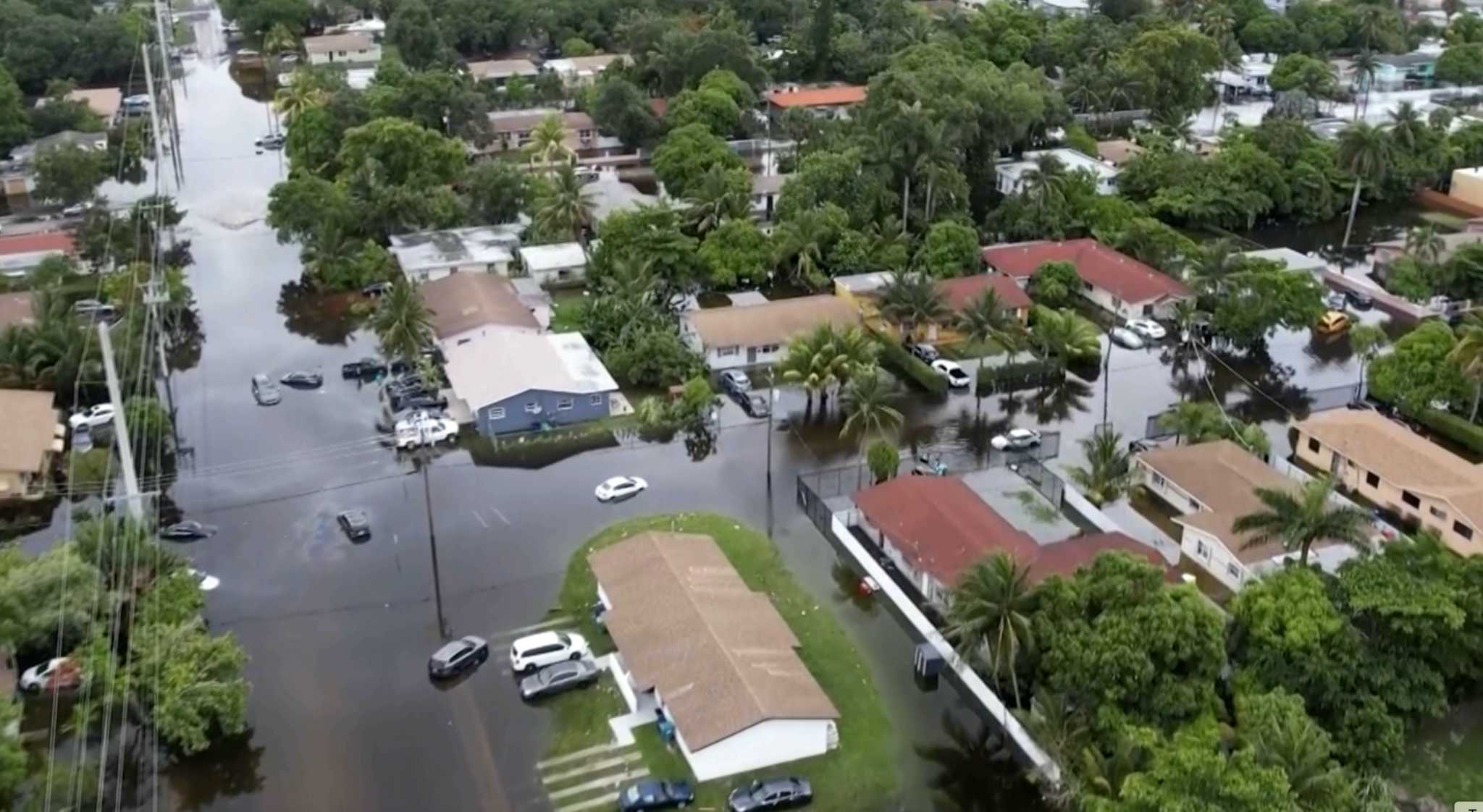 Tropical rainstorms in South Florida lead to flight delays and streets jammed with stalled cars