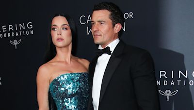 Katy Perry and Orlando Bloom pack on the PDA at Caring for Women gala