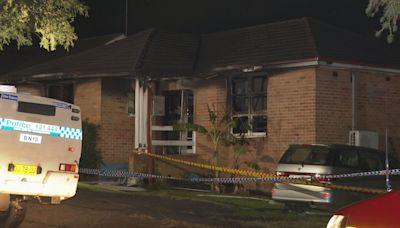 Three children dead, man in custody after house fire in Sydney's west