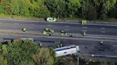 A bus carrying children overturns in northwest England, killing the driver and a 14-year-old girl