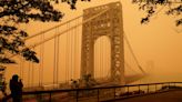 Surreal photos show NYC covered in glowing orange haze from Canada wildfire smoke