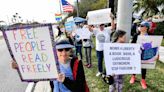 'You want to ban the books? I’m giving them away.' Activists protest Florida book-ban law