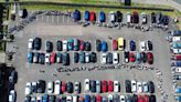 Picture shows 1,000-strong queue snaking round car park to see Nigel Farage