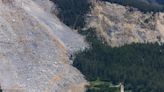 Images show how a Swiss Alps village narrowly escaped being wiped out by a massive rockslide that missed 'by a hair'