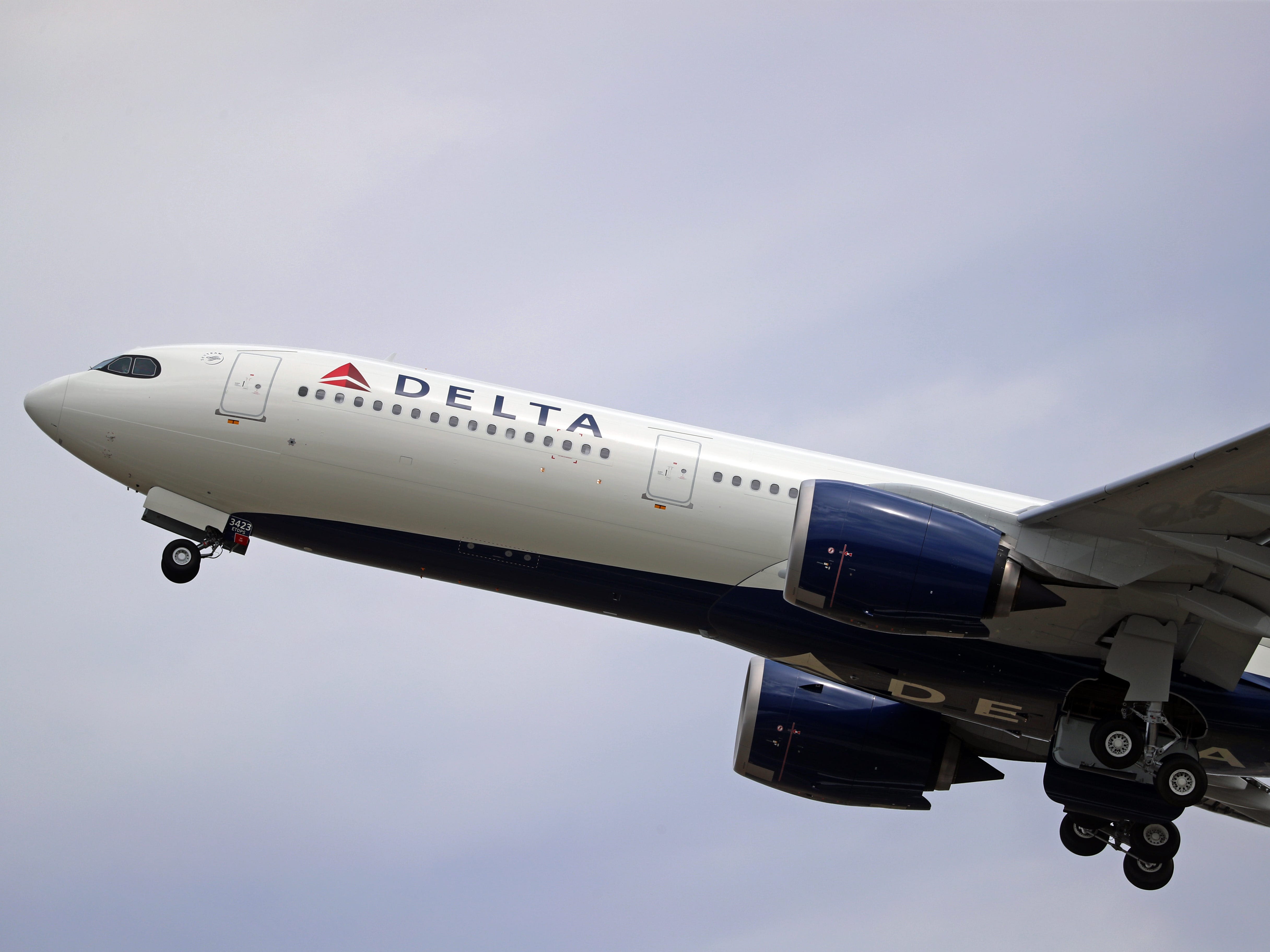 A passenger is suing Delta for $1 million, saying he broke a rib when he leaned on his armrest and it collapsed