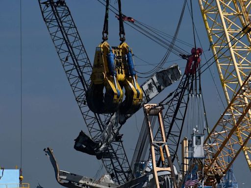 Large crane removes wreckage from Francis Scott Key Bridge collapse