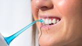 Do you need a water flosser — and should you be filling it with mouthwash? What dentists say about a new viral trend.