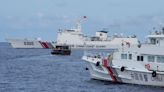 Philippine boats breach a Chinese coast guard blockade in a faceoff near a disputed shoal