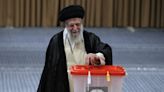 Iran holds runoff presidential vote pitting hard-line former negotiator against reformist lawmaker