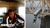 New video shows crash that left truck dangling off bridge