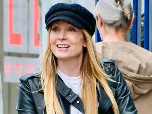 Joanne Froggatt takes her newborn for a stroll after giving birth