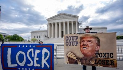 The Latest: Trump takes to social media before Supreme Court arguments