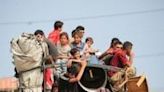 Palestinians flee the area of Tal al-Sultan in Rafah with their belongings following renewed Israeli strikes in the city in the southern Gaza Strip on May 28, 2024