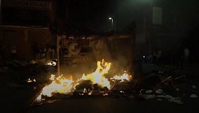 Vehicles set alight and police car overturned amid disorder in Leeds suburb