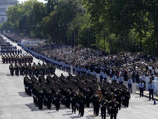 France's annual Bastille Day parade highlights Olympic flame relay, D-Day landings