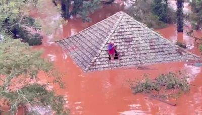 Residents rescued from rooftops following mass floods in Brazil