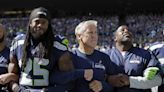 Richard Sherman consulting with Pete Carroll about the Seahawks’ young, new secondary