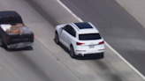 Pursuit underway of stolen white Audi SUV through Los Angeles area