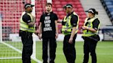 Protestor chains himself to a goalpost ahead of Scotland-Israel women's match