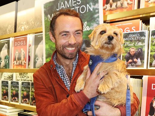 James Middleton poses with therapy dogs for Chelsea Dog Day