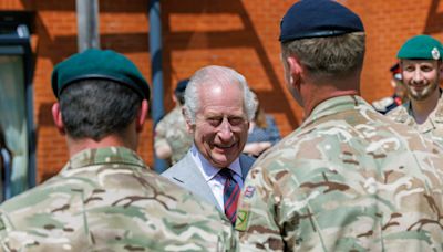 King ‘glad to be out of cage’ in first military visit since cancer diagnosis