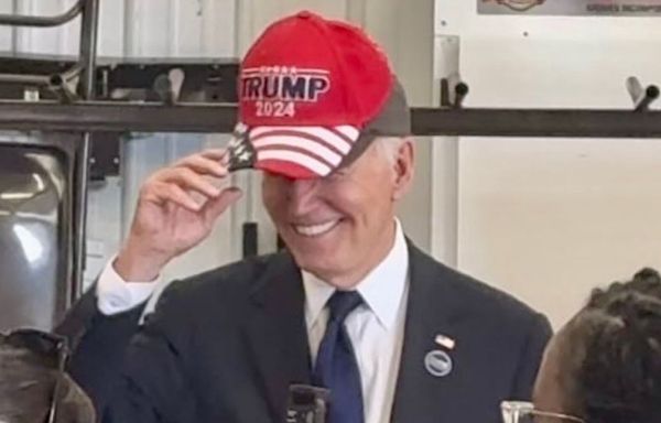 Joe Biden wears Trump MAGA hat as he's called 'old fart' by supporter