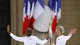Olympic torch relay works its way past Paris landmarks in buildup to Games