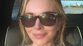 Lindsay Lohan, 38, poses for radiant 'TGIF' selfie in her car
