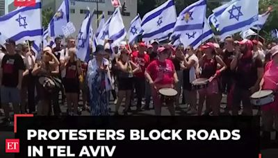 Protesters block roads in Tel Aviv and Jerusalem as they mark nine months since start of Gaza war