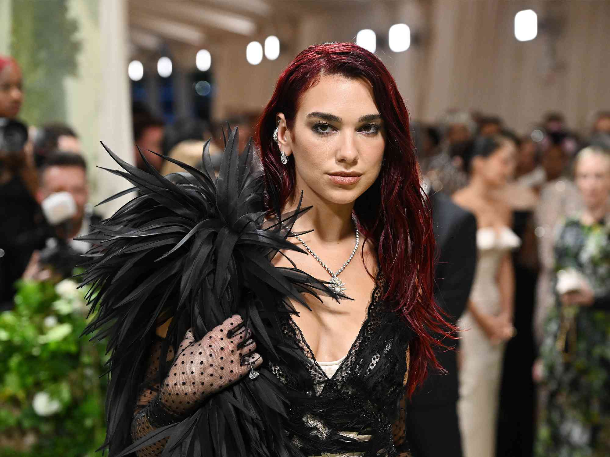 Dua Lipa Paired Her Crystal-Encrusted Crop Top With Fishnet Gloves at the Met Gala After-Party