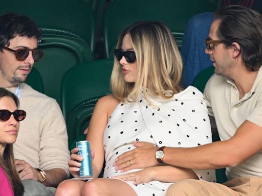 The Way Margot Robbie's Husband Touches Her Baby Bump Is A Sign Of 'Protection'