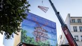 Paris’ famous Moulin Rouge windmill gets its blades back | CNN