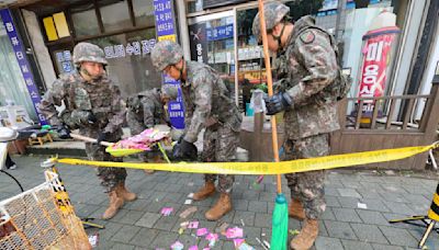 Trash dropped by a North Korean balloon falls on South Korea’s presidential compound