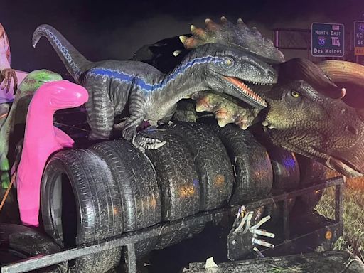 Truck hauling life-sized dinosaurs crashes on highway after storm