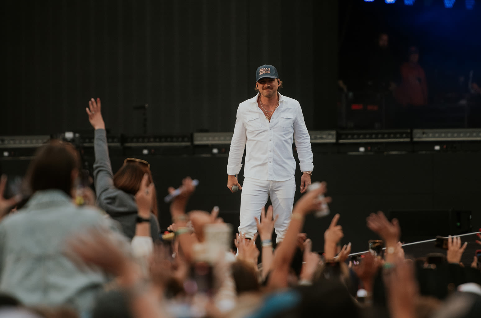 Patrick Mahomes, Ashton Kutcher & Mila Kunis Among Celebrities at Morgan Wallen’s BST Hyde Park Concert in London