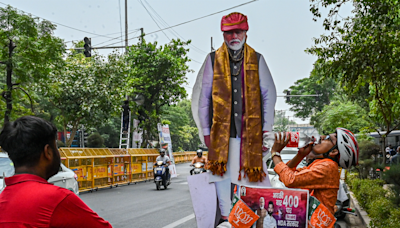 India's Modi heading for reduced majority, early results suggest