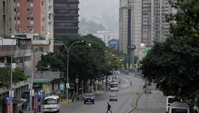 Normally bustling Venezuelan capital is unusually quiet after both sides claim victory in election