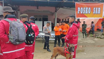 A landslide triggered by heavy rain leaves 11 dead, dozens missing at illegal gold mine in Indonesia